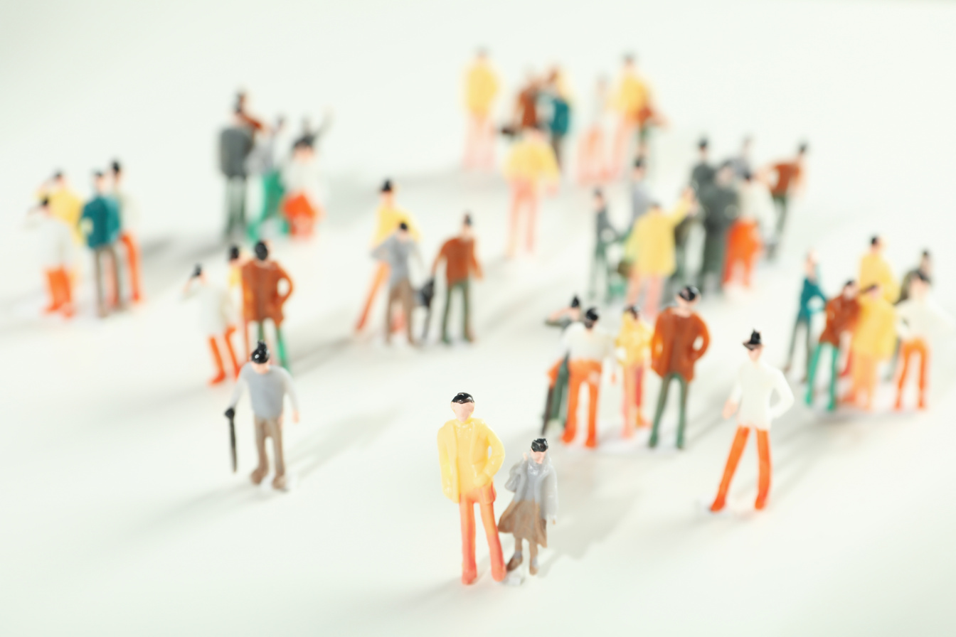 Concept of population with toy people, selective focus